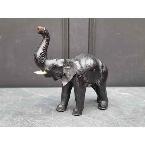 1481 - A small leather Elephant, stamped 'Liberty', 31cm high.