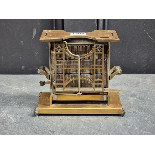 1492 - A rare early 20th century American brass toaster, by Landers, Frary & Clark, 19.5cm wide.... 