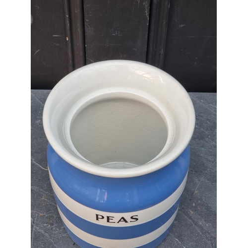 1493 - A T G Green & Co Cornishware 'Peas' storage jar and cover, 20cm high; together with an orange gl... 