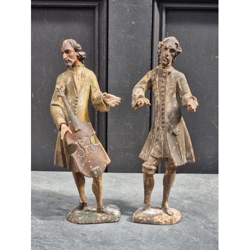 1497 - A pair of antique Continental carved softwood musicians, 32.5cm high, (damage and losses).... 