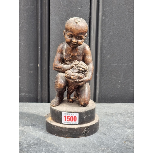 1500 - An antique Continental carved softwood kneeling child, 22cm high.