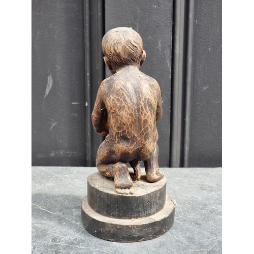 1500 - An antique Continental carved softwood kneeling child, 22cm high.