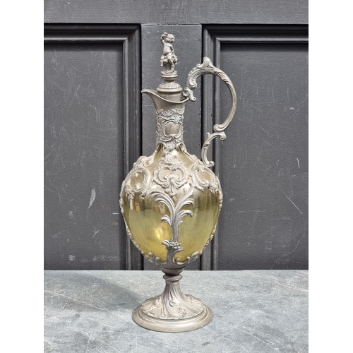 1515 - A Continental Art Nouveau pewter and green glass claret jug and stopper, 39cm high, (the stoppe... 