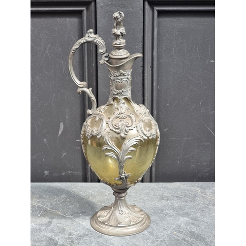 1515 - A Continental Art Nouveau pewter and green glass claret jug and stopper, 39cm high, (the stoppe... 