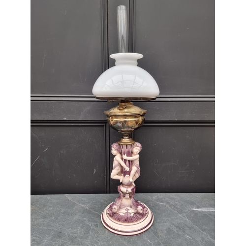 1519 - An Italian pottery figural oil lamp, height excluding chimney 66.5cm high, (repaired and conver... 