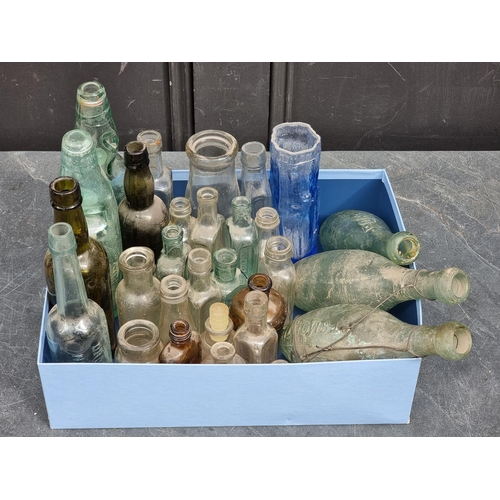 1527 - A collection of Victorian and later glass bottles; together with a small Whitefriars style vase... 