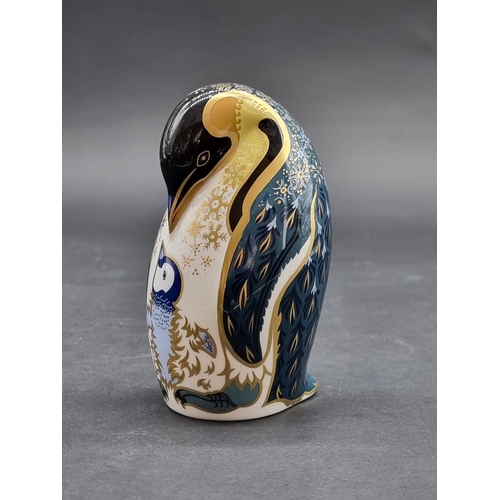 1544 - Royal Crown Derby Imari Paperweights: 'Emperor Penguin and Chick', gilt signed, with silver stopper.... 