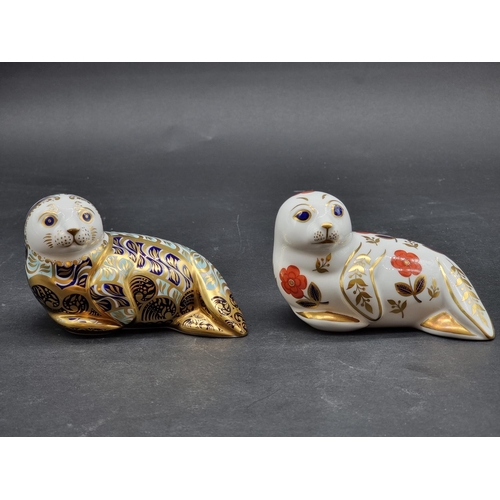 1580 - Royal Crown Derby Imari paperweights: two 'Harbour Seals', one gilt signed and with gold stopper, th... 