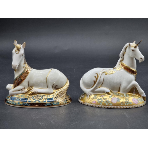 1596 - Royal Crown Derby Imari paperweights: two 'Unicorns', one gilt signed, each with gold stopper. (2)... 