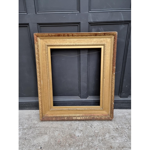 1212 - A large giltwood and gesso picture frame, rebate of slip 77 x 64.5cm.