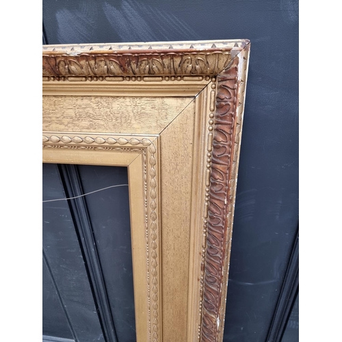 1212 - A large giltwood and gesso picture frame, rebate of slip 77 x 64.5cm.