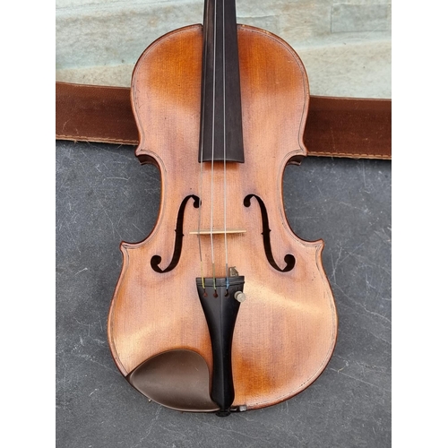 1679 - An interesting antique Continental violin, with 14in two piece back, internally inscribed in ink 'T ... 