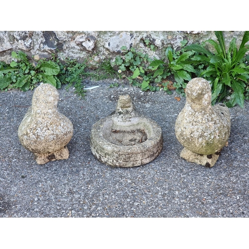 1721 - A pair of old weathered composition stone doves, 29cm high; together with a similar small birdbath, ... 