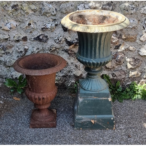 1722 - Two old cast iron Campana urns, one with plinth base, 68cm high. (2)