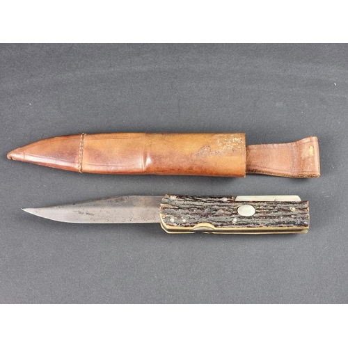 503 - A rare circa 1920s folding Bowie knife and leather sheath, by G Ibberson, the 19cm blade stamped 'Ib... 