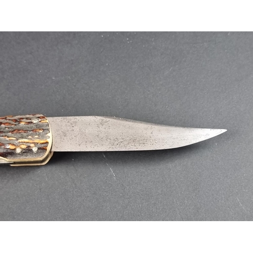 503 - A rare circa 1920s folding Bowie knife and leather sheath, by G Ibberson, the 19cm blade stamped 'Ib... 