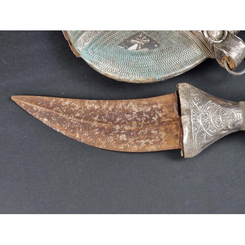 518 - An Arab Omani four ring jambiya, having 14cm blade.