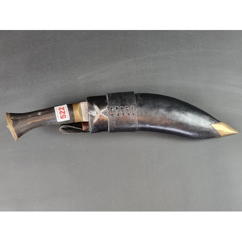 522 - A kukri and scabbard, the 16cm curved blade stamped 'Gorkha Army 3032'.