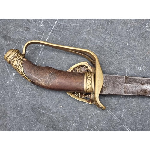 535 - A Turkish Ottoman Empire sword and scabbard, having 84cm curved blade, with brass guard and wooden g... 