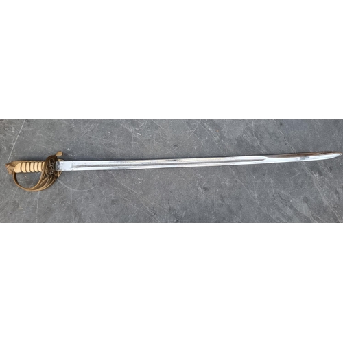 541 - An 1827 pattern Naval officer's sword, having 78cm etched blade.