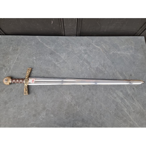 546 - A reproduction Spanish broad sword, marked 'Made in Spain', with 83cm unsharpened blade.... 