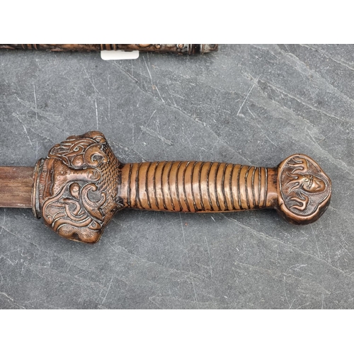 553 - A Chinese ceremonial Jian type sword and scabbard, having decorative copper fittings, with 67cm blad... 