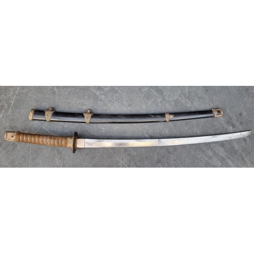 556 - A WWII Imperial Japanese officer's shin gunto, single edged, with 65cm blade, overall length 96.5cm.... 