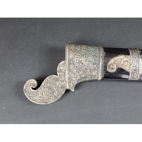 559 - A 19th century Indonesian parang and scabbard, with 32.5cm blade, carved wood Dragon's head pommel a... 