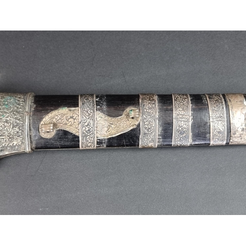 559 - A 19th century Indonesian parang and scabbard, with 32.5cm blade, carved wood Dragon's head pommel a... 