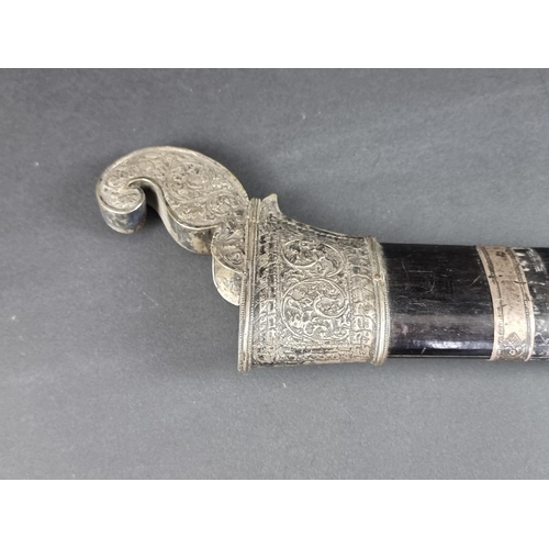 559 - A 19th century Indonesian parang and scabbard, with 32.5cm blade, carved wood Dragon's head pommel a... 