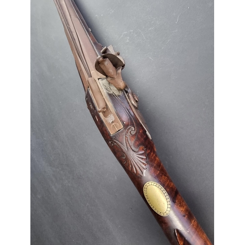 563 - A late 18th/early 19th century flintlock blunderbuss, with steel barrel and top mounted sprung bayon... 