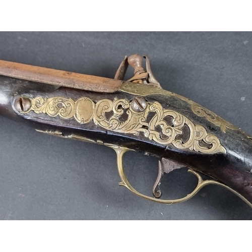 564 - An 18th century brass mounted flintlock pistol, possibly Spanish, with some residual silver plating,... 