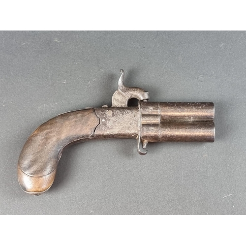 567 - A 19th century double barrelled turnover percussion pistol, with folding trigger and top strap safet... 