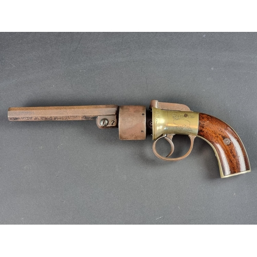 571 - An early 19th century British transitional percussion six-shot revolver, with brass action and barre... 