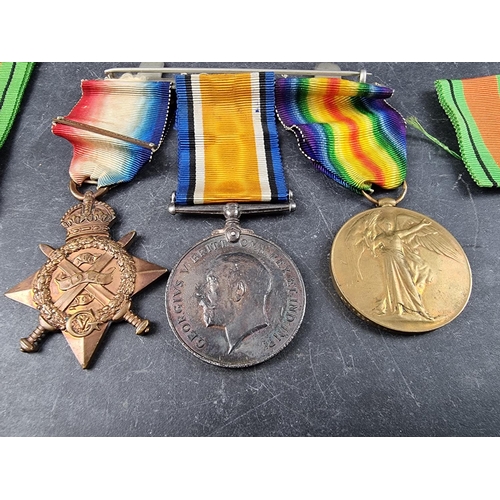 592 - Medals: A WWI trio to L. 11391 Ptr/Cpl R.G Wood 4/R.Fus, to include a 1914 star; together with a WWI... 