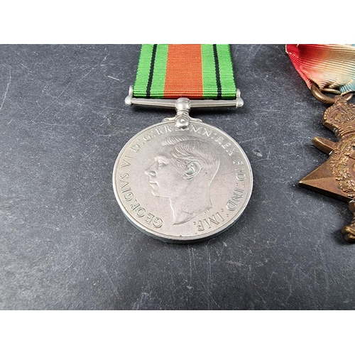 592 - Medals: A WWI trio to L. 11391 Ptr/Cpl R.G Wood 4/R.Fus, to include a 1914 star; together with a WWI... 