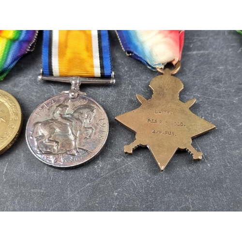 592 - Medals: A WWI trio to L. 11391 Ptr/Cpl R.G Wood 4/R.Fus, to include a 1914 star; together with a WWI... 