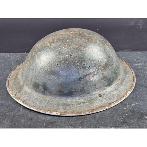 725 - A WWII British Brodie MK2 steel helmet.