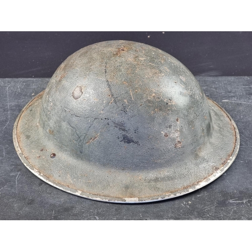 725 - A WWII British Brodie MK2 steel helmet.