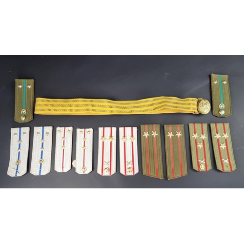 728 - A small collection of Soviet epaulettes and a belt.