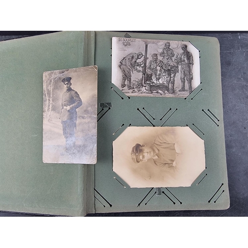 731 - A German WWI album, containing a small quantity of postcards and photographs.