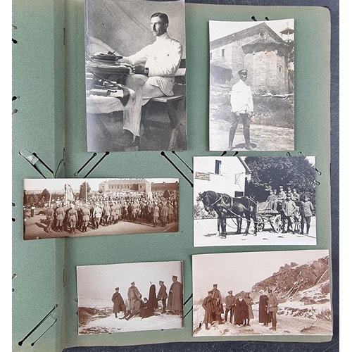 731 - A German WWI album, containing a small quantity of postcards and photographs.