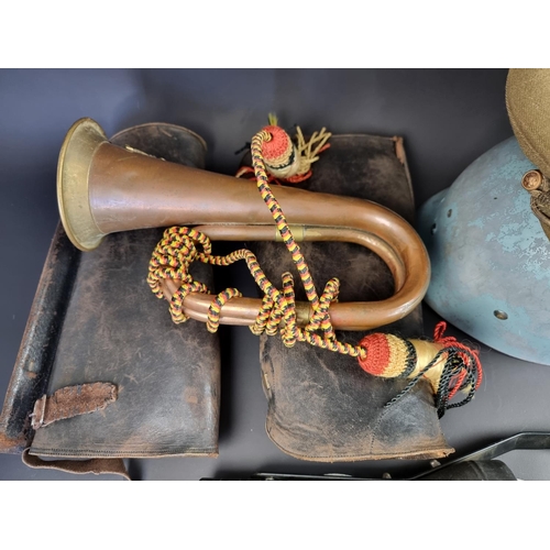 736 - A quantity of militaria, to include a helmet and a pair of leather cavalry gaiters.