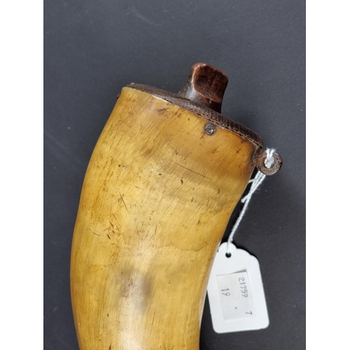 741 - A brass and wood mounted powder horn, 29cm.