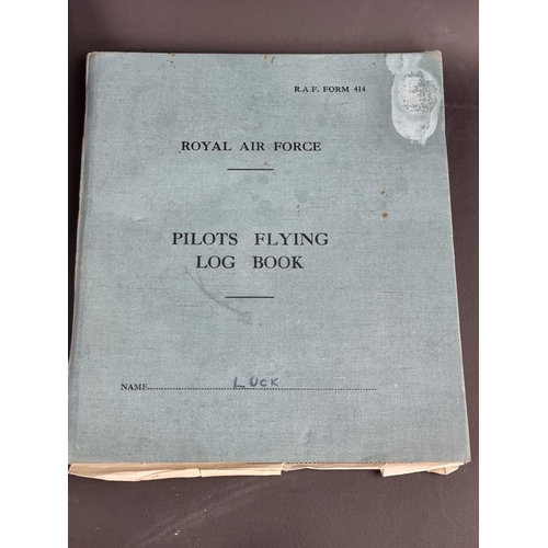 742 - An RAF pilot's flying log book, Flt Lt D.C Luck; together with three other items.