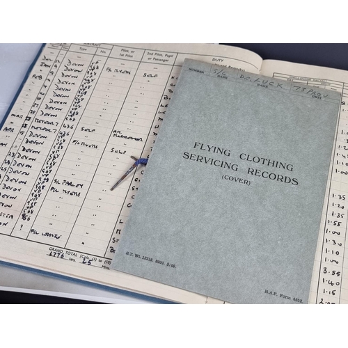 742 - An RAF pilot's flying log book, Flt Lt D.C Luck; together with three other items.