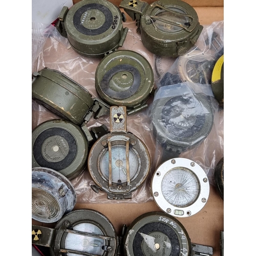 746 - A quantity of British army compasses, (spares or repairs).