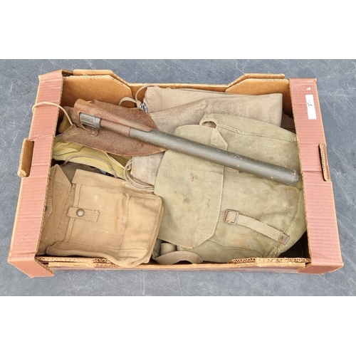 748 - A quantity of WWII webbing and an entrenching tool.