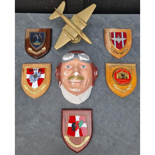 749 - A quantity of assorted mess plaques; together with a painted plaster pilot wall plaque and a brass p... 