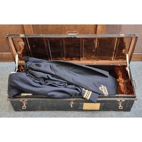 757 - A Royal Navy Lieutenant Commander's uniform, in a black painted steel travelling case.... 